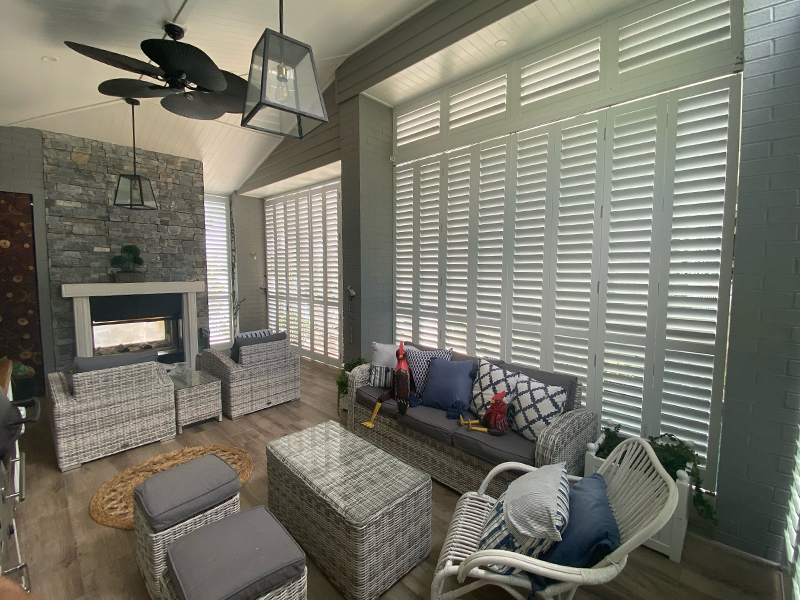 living area with white shutters