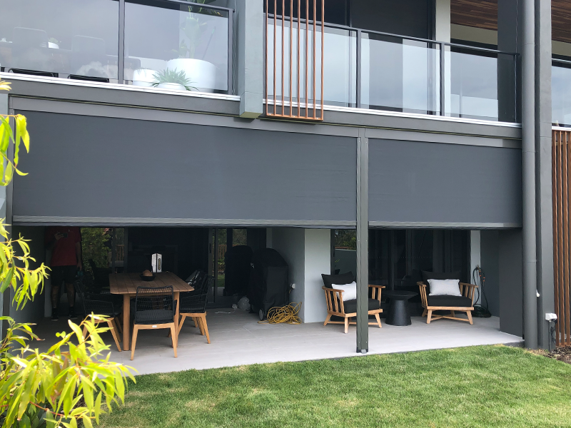 Outdoor downstairs area with large blind