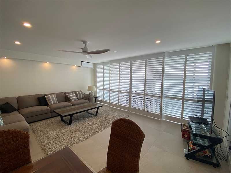 Long and tall white wooden shutters