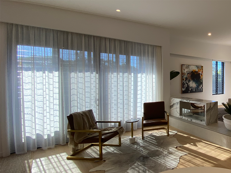 dining area with white curtains